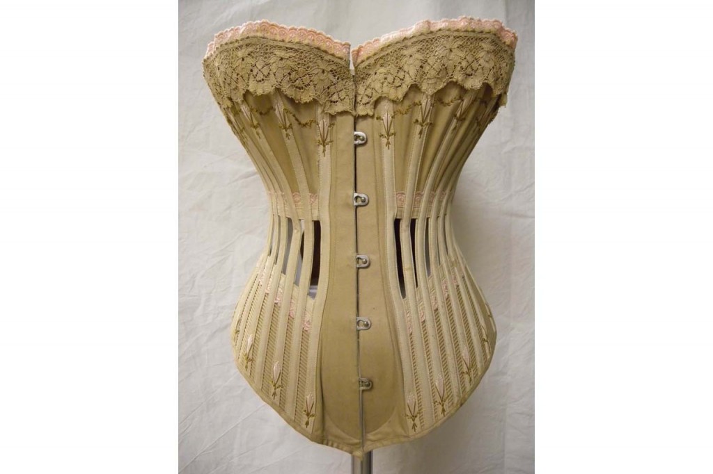 Ribbon Corset, 1904 Corset with bones at the sides and front, usually worn informally or for sport. This example formed part of the wedding trousseau of Elsie Winifred Gledhill, bride of Reverend Francis Rawson Briggs. Ivory silk satin ribbon, trimmed with a satin rosette. The Bowes Museum